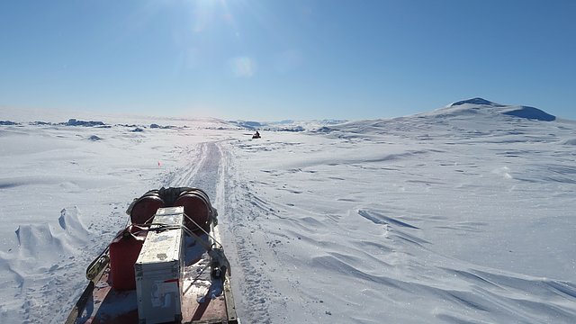 Ski-Doo ride to our worksite, passing by giant hummocks of multiyear sea ice.
